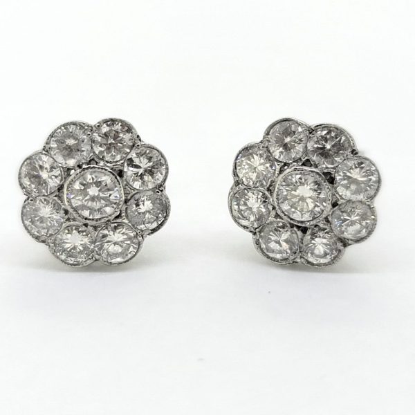 Diamond Daisy Flower Cluster Stud Earrings, 0.80 carats sparkling round brilliant-cut diamonds arranged in floral cluster design in 18ct white gold
