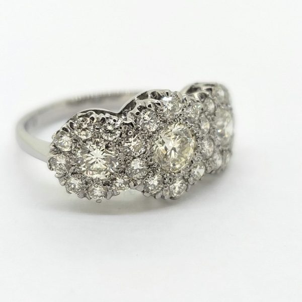 Modern Triple Diamond Three Stone Trilogy Cluster Engagement Ring in Platinum, three principal diamonds all within diamond surrounds, 1.85 carat total
