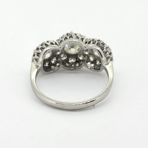 Contemporary Triple Diamond Cluster Three Stone Ring in Platinum, three principal diamonds all within diamond surrounds,: 1.85 carat total