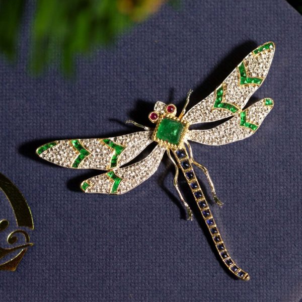 Multi Gemstone Dragonfly Brooch with Emerald Sapphire Ruby and Diamond, emerald body sapphire tail diamond wings and ruby eyes in 18ct yellow gold
