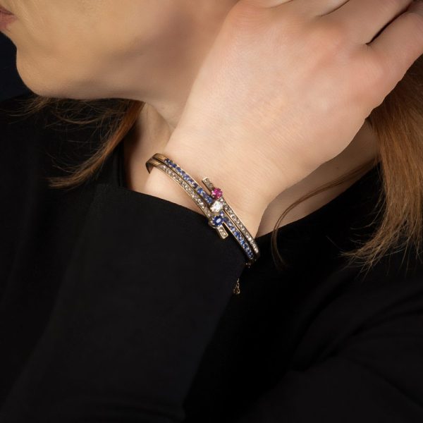 Edwardian gold bangle with diamonds, sapphires and a ruby.
