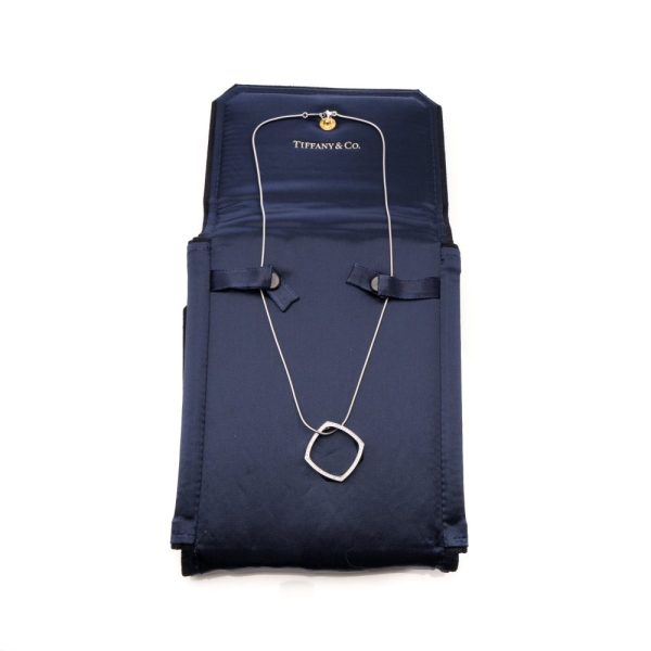 Tiffany & Co. gold necklace with diamond square pendant.