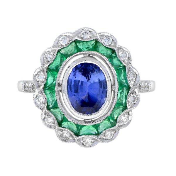 1.50ct Ceylon Sapphire with Emerald and Diamond Cluster Engagement Ring, 1.50ct oval cut Ceylon Sapphire surrounded by emerald halo and outer border of sparkling diamonds in 18ct white gold