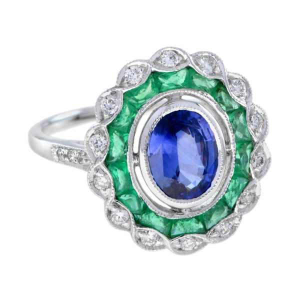 1.50ct Ceylon Sapphire with Emerald and Diamond Cluster Engagement Ring, 1.50ct oval cut Ceylon Sapphire surrounded by emerald halo and outer border of sparkling diamonds in 18ct white gold