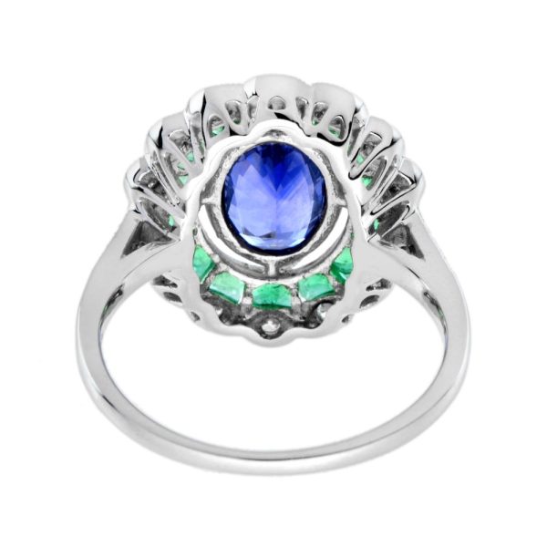 1.50ct Ceylon Sapphire with Emerald and Diamond Cluster Engagement Ring, 1.50ct oval cut Ceylon Sapphire surrounded by emerald halo and outer border of sparkling diamonds in 18ct white gold