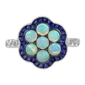 1ct Opal and Sapphire Cluster Engagement Ring with Diamond Shoulders, cabochon-cut opals surrounded by calibre French-cut blue sapphire border in 14ct white gold with diamond set shoulders