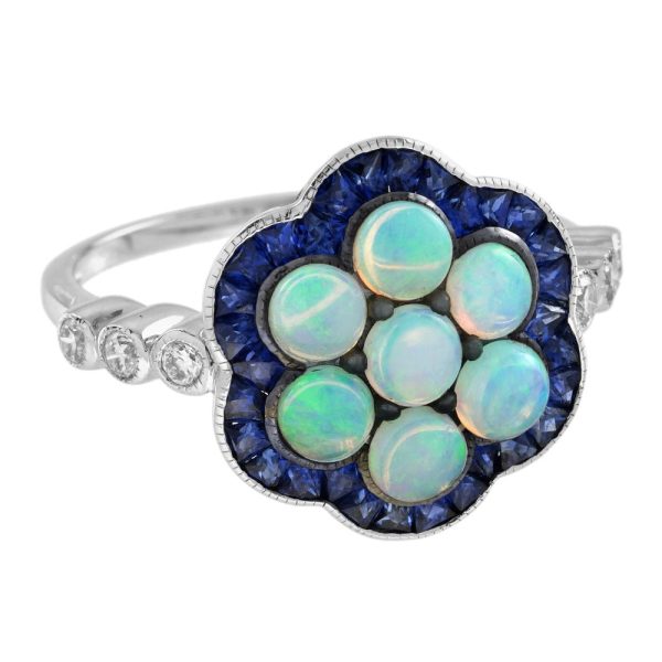 1ct Opal and Sapphire Cluster Engagement Ring with Diamond Shoulders, cabochon-cut opals surrounded by calibre French-cut blue sapphire border in 14ct white gold with diamond set shoulders
