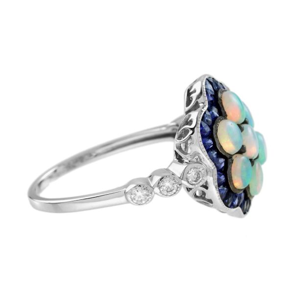 1ct Opal and Sapphire Cluster Engagement Ring with Diamond Shoulders, cabochon-cut opals surrounded by calibre French-cut blue sapphire border in 14ct white gold with diamond set shoulders