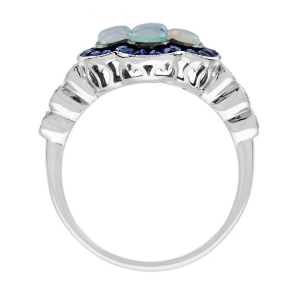1ct Opal and Sapphire Cluster Engagement Ring with Diamond Shoulders, cabochon-cut opals surrounded by calibre French-cut blue sapphire border in 14ct white gold with diamond set shoulders