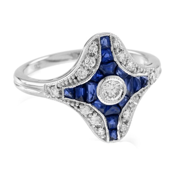Diamond and Sapphire Navette Cluster Plaque Ring, central sparkling diamond surrounded by calibre French-cut blue sapphires within outer diamond border in 14ct white gold