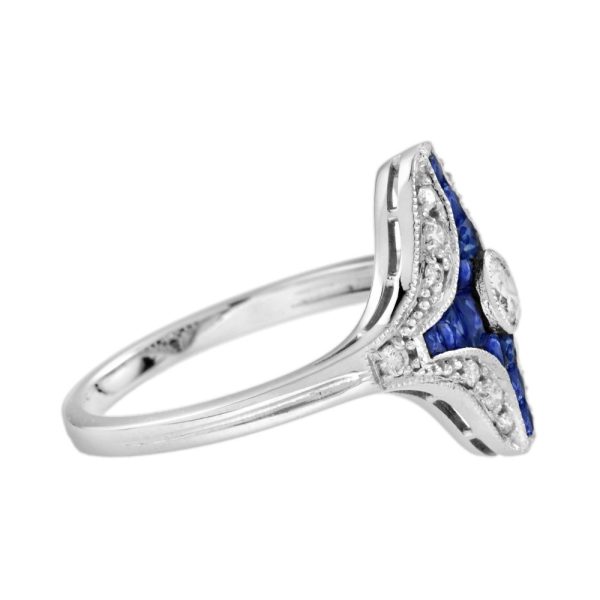 Diamond and Sapphire Navette Cluster Plaque Ring, central sparkling diamond surrounded by calibre French-cut blue sapphires within outer diamond border in 14ct white gold