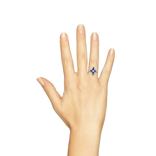 Diamond and Sapphire Navette Cluster Plaque Ring, central sparkling diamond surrounded by calibre French-cut blue sapphires within outer diamond border in 14ct white gold