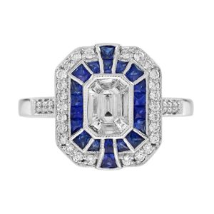 Diamond and Sapphire Cluster Engagement Ring in 18ct White Gold, centre composed of nine separate diamond illusion set into larger emerald-cut diamond design surrounded by sapphire halo and outer diamond border