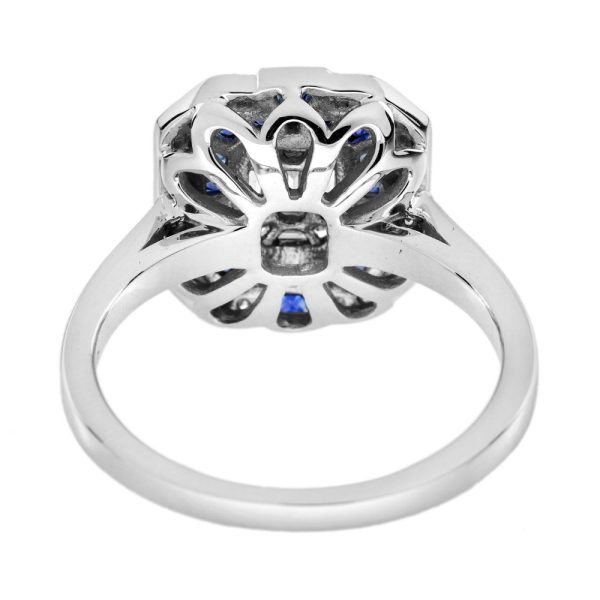 Diamond and Sapphire Cluster Engagement Ring in 18ct White Gold, centre composed of nine separate diamond illusion set into larger emerald-cut diamond design surrounded by sapphire halo and outer diamond border