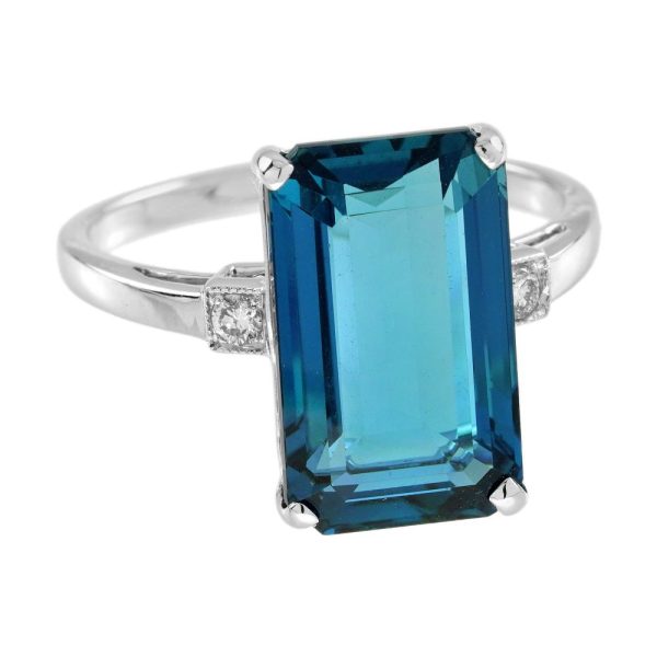 8.80ct Emerald Cut Blue Topaz Solitaire Engagement Ring, single stone deep greenish-blue London topaz with sparkling diamond to each side in 18ct white gold