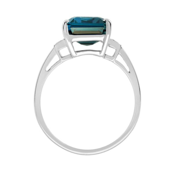 8.80ct Emerald Cut Blue Topaz Solitaire Engagement Ring, single stone deep greenish-blue London topaz with sparkling diamond to each side in 18ct white gold
