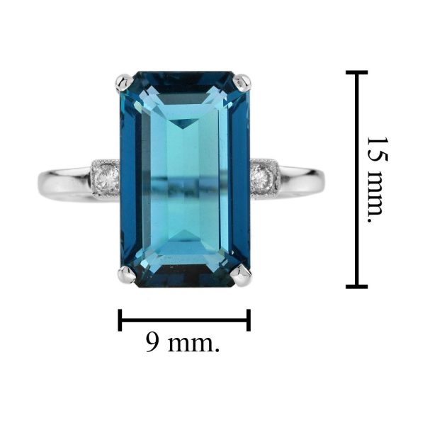8.80ct Emerald Cut Blue Topaz Solitaire Engagement Ring, single stone deep greenish-blue London topaz with sparkling diamond to each side in 18ct white gold