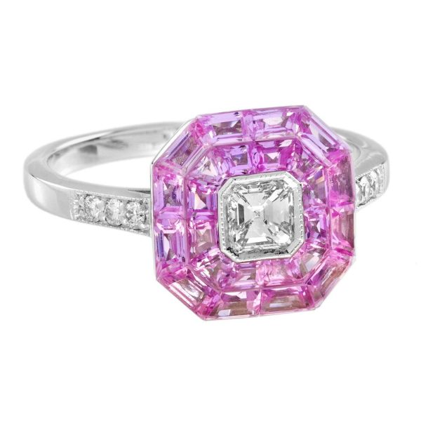 Asscher Cut Diamond and Pink Sapphire Engagement Ring, 0.30ct Asscher-cut diamond is surrounded by invisible set vibrant pink sapphires creating solid solitaire design in 18ct white gold with diamond-set shoulders