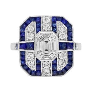 Contemporary Diamond and Sapphire Cluster Plaque Ring, Nine diamond illusion set diamonds form the emerald-shaped centre with diamond and geometric sapphire border in 18ct white gold