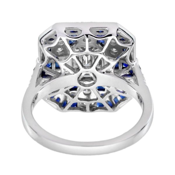 Contemporary Diamond and Sapphire Cluster Plaque Ring, Nine diamond illusion set diamonds form the emerald-shaped centre with diamond and geometric sapphire border in 18ct white gold