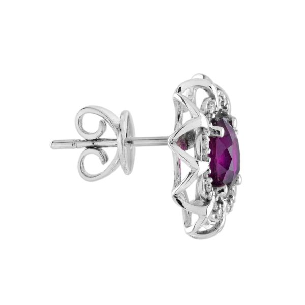 2ct Ruby and Diamond Flower Cluster Stud Earrings, oval red rubies within diamond halo surround and outer gold floral design border in 14ct white gold