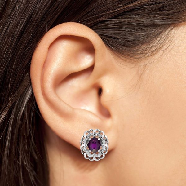 2ct Ruby and Diamond Flower Cluster Stud Earrings, oval red rubies within diamond halo surround and outer gold floral design border in 14ct white gold