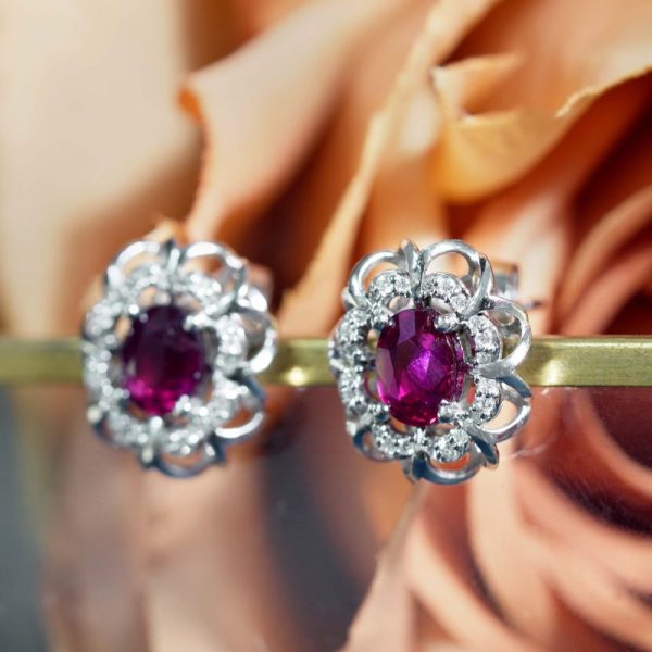 2ct Ruby and Diamond Cluster Stud Earrings, oval red rubies within diamond halo surround and outer gold floral design border in 14ct white gold