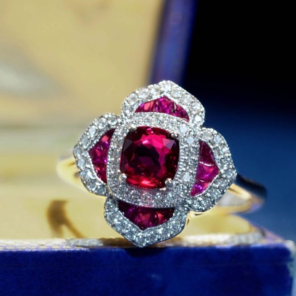 Certified 1ct Natural Ruby and Diamond Flower Cluster Engagement Ring, 1.02ct natural cushion-shaped ruby surrounded by ruby petals with sparkling diamond borders in 14ct white gold