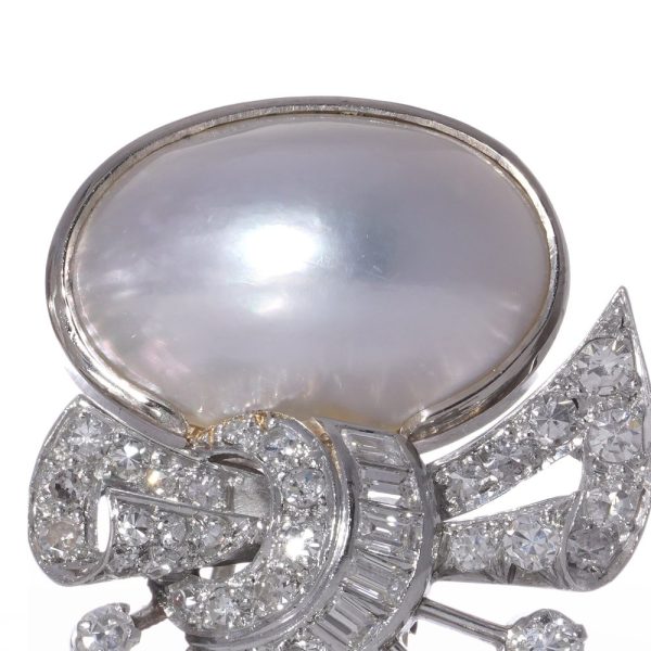 Vintage pearl and diamond earrings in platinum.