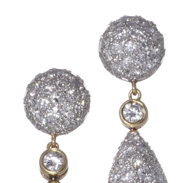 Diamond drop earrings in yellow and white gold.