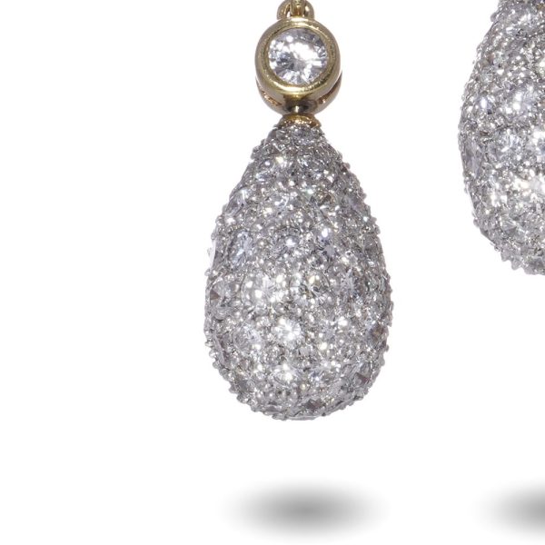 Diamond drop earrings in yellow and white gold.
