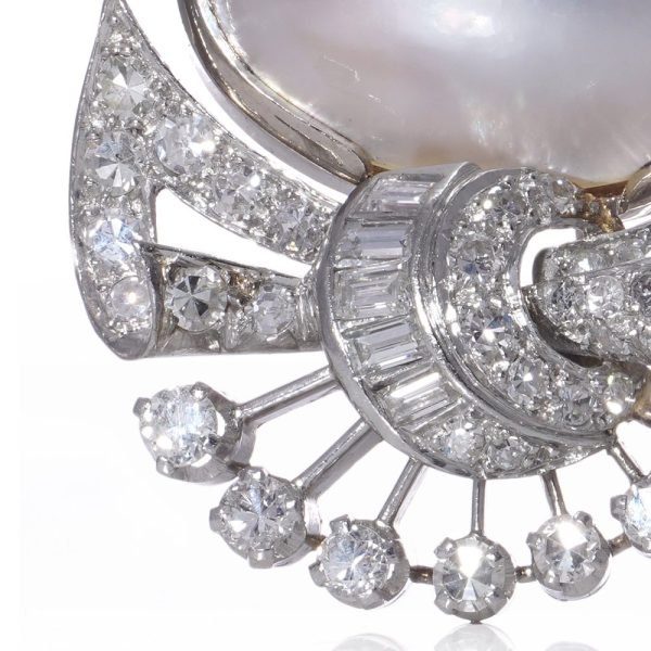 Vintage pearl and diamond earrings in platinum.