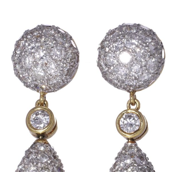 Diamond drop earrings in yellow and white gold.