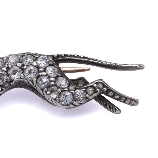 Antique gold and silver greyhound brooch with diamonds and ruby.