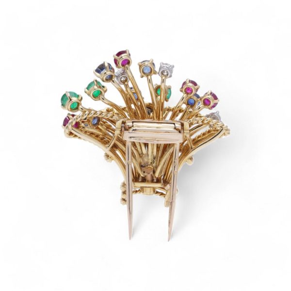 Cartier vintage flower basket brooch with gemstones in gold.