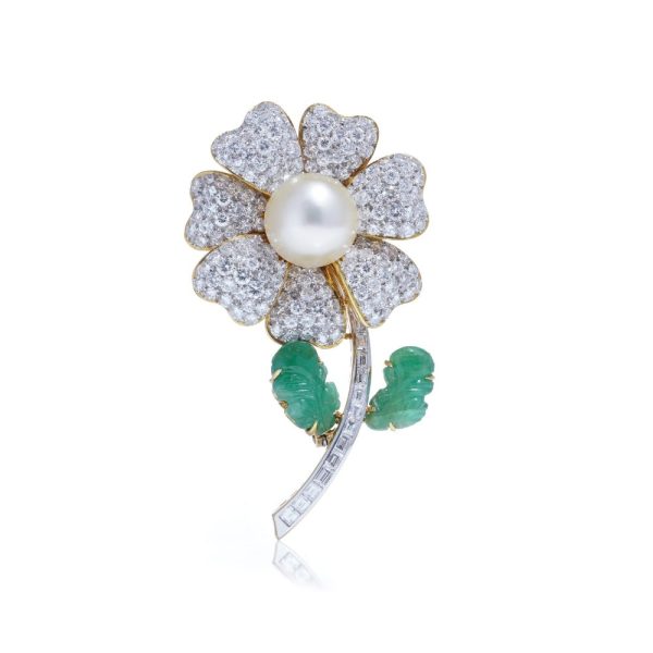 Floral brooch with pearl, diamonds and emeralds in gold.