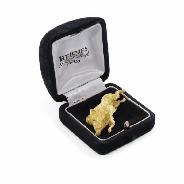 Gold running wild boar brooch.