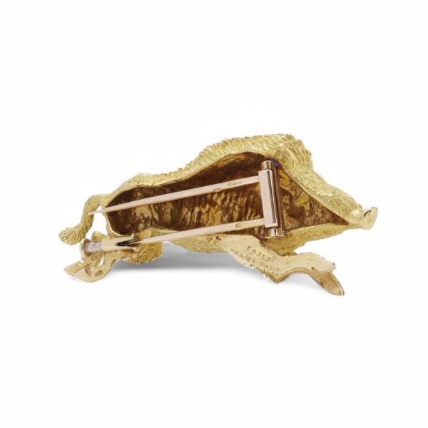 Gold running wild boar brooch.