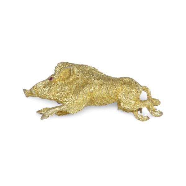 Gold running wild boar brooch.
