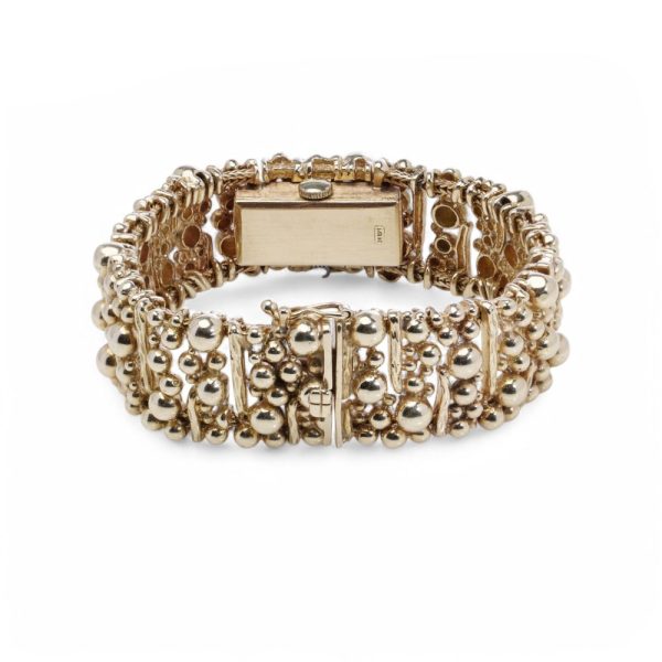 Van Cleef & Arpels gold bracelet watch.