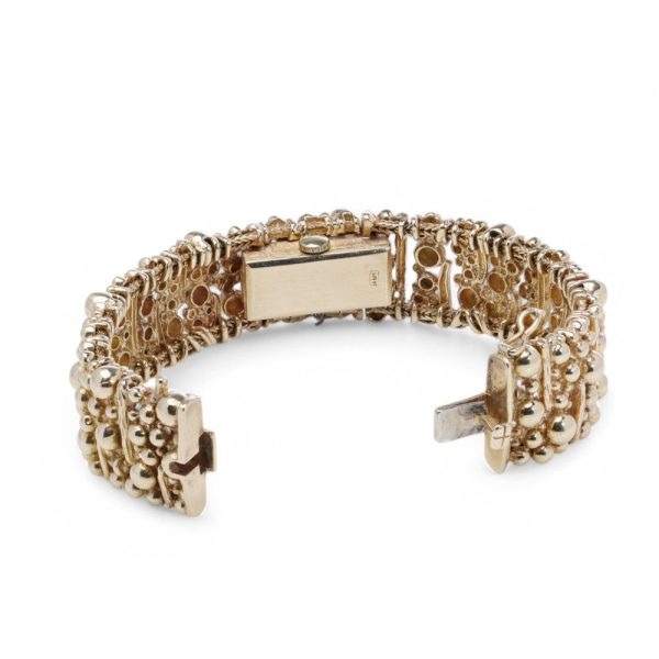 Van Cleef & Arpels gold bracelet watch.