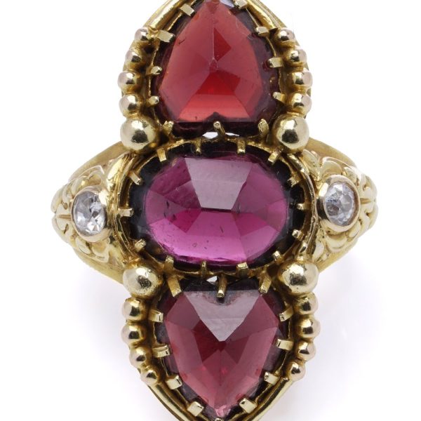 Garnet and diamond ring in gold.