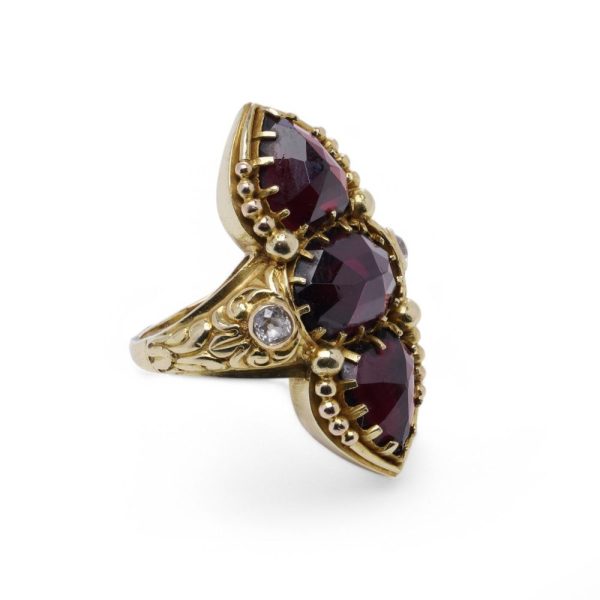 Garnet and diamond ring in gold.