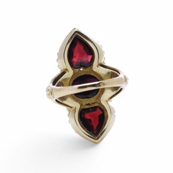 Garnet and diamond ring in gold.