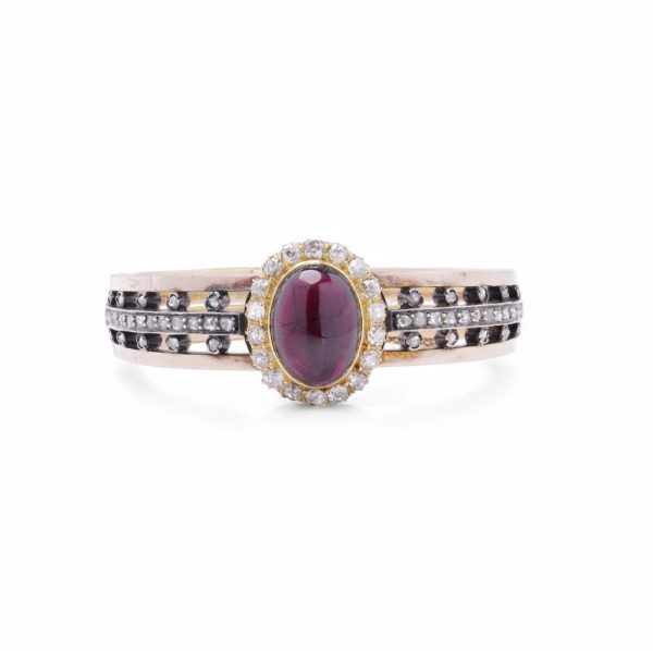 Antique garnet and diamond bangle in yellow gold and silver.
