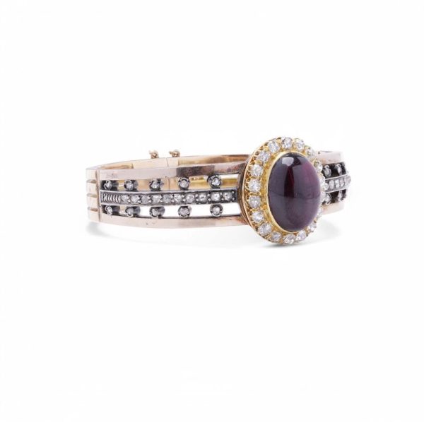 Antique garnet and diamond bangle in yellow gold and silver.