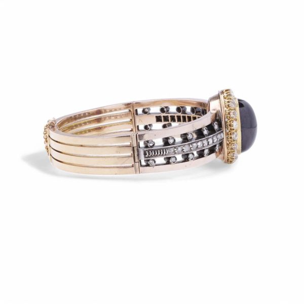 Antique garnet and diamond bangle in yellow gold and silver.