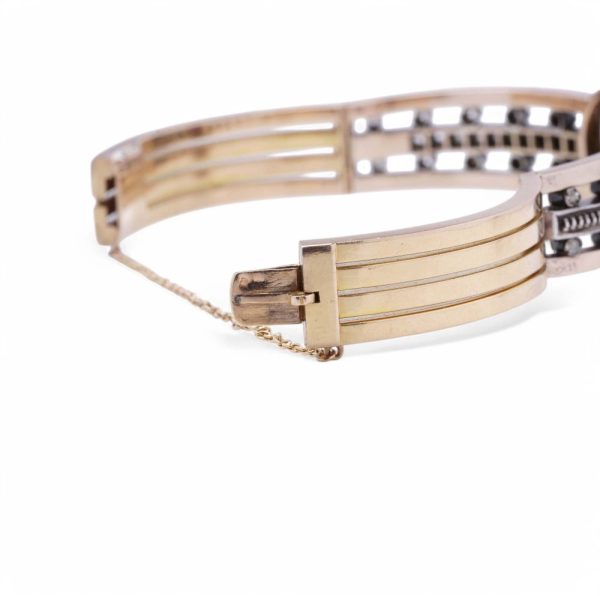 Antique garnet and diamond bangle in yellow gold and silver.