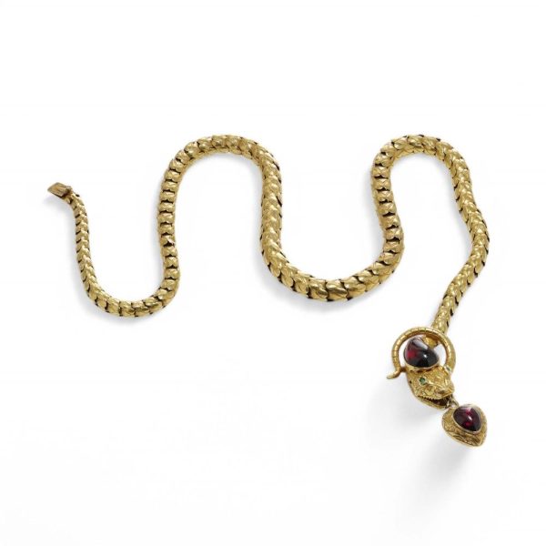 Victorian snake necklace with garnets and emeralds in gold.