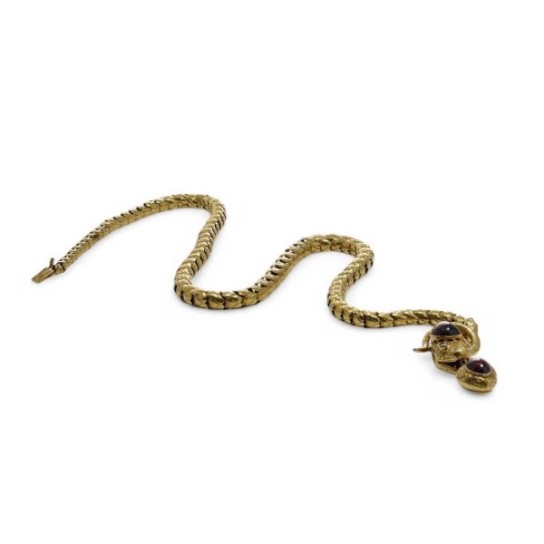 Victorian snake necklace with garnets and emeralds in gold.